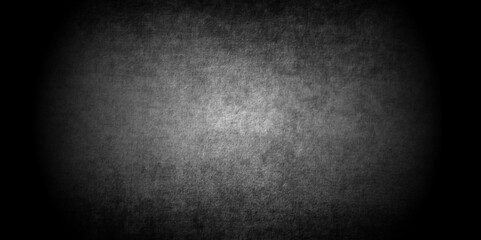 Abstract design with grunge black and white background . Old cement wall . scary dark texture of old paper parchment and .decorative plaster or concrete with vignette  paper texture design .Dark wall 