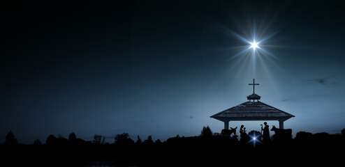 Fototapeta premium Bright Star of Bethlehem, or Christmas Star. Silhouettes of Jesus Christ, Mary, Joseph and animals.