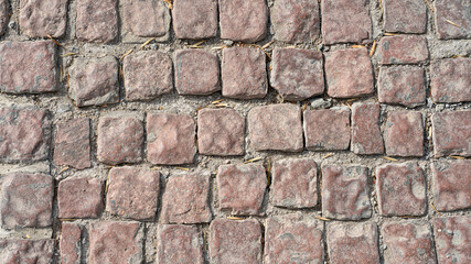 Stone pavement texture. Abstract background of cobblestone pavement