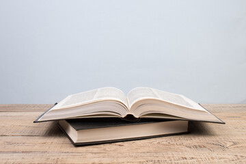 open book. Composition with hardcover books, fanned pages, isolated on white background. Back to school. Copy Space. Education background.