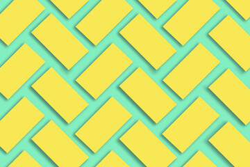 Mockup of stacks of gold business cards arranged in rows on a green textured paper background.