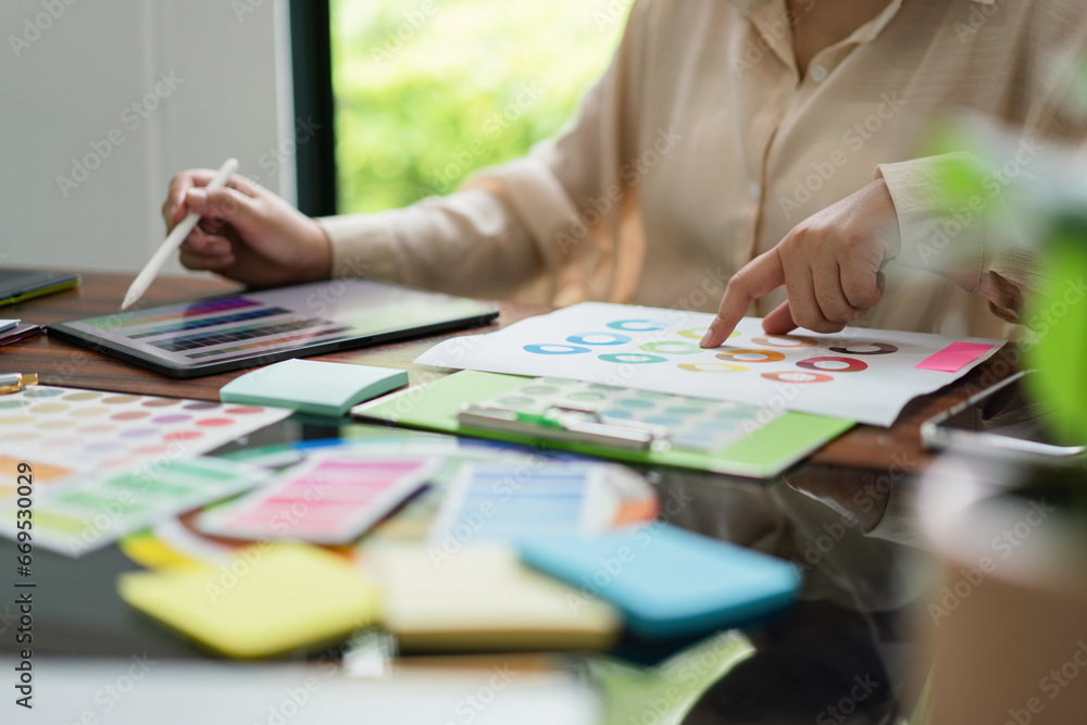 Poster creative graphic designer working about color swatch on tablet and document for designing project
