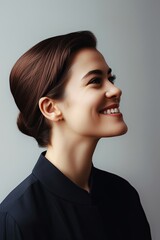 profile view of European business woman smiling against light background, copy space