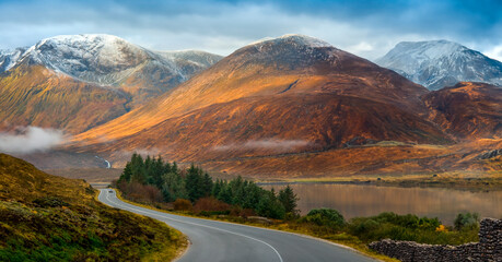 Car on a country road on the Isle of Skye in northwest Scotland. United Kingdom