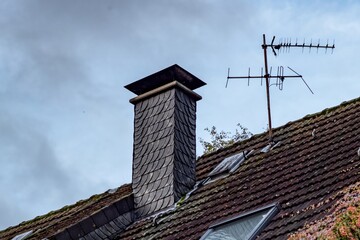chimney and tv antenna on roof