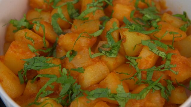 LEBANESE RECIPE FOR SPICY POTATOES, BATTATA HARA, GARLIC, CORIANDER AND PAPRIKA. High quality VIDEO