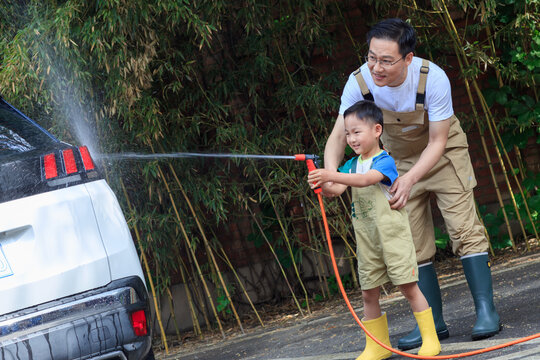 Happy father and son washed the car