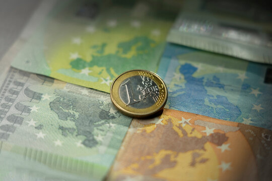 One euro coin - on the background of Europe's map created by euro banknotes, European Union, one united Europe 