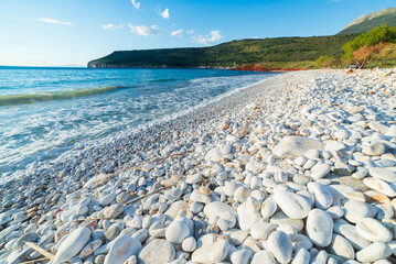 Beautiful beach and water bay in the greek spectacular coast line. Turquoise blue transparent...