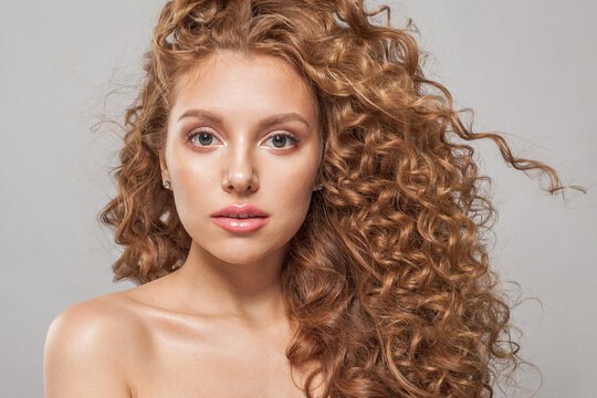 Perfect Young Redhead Woman With Long Healthy Wavy Red Hair. Natural Beauty Without Retouching. Beautiful Curly Hair Female Model, Closeup Portrait