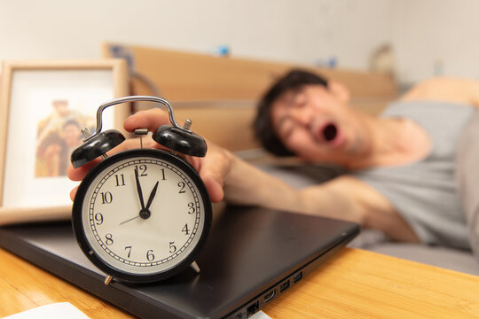 North drift middle-aged man presses alarm clock