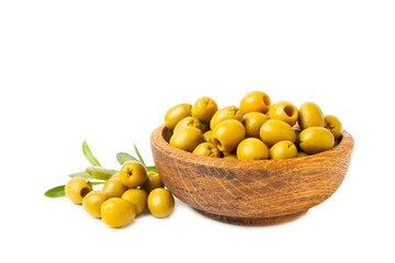 Delicious green olives isolated on white background. Olive and olive tree branches on a white table. Delicacy.