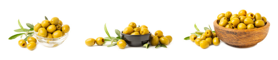 Delicious green olives isolated on white background. Olive and olive tree branches on a white table. Delicacy.