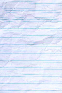 Top view vertical empty rumpled lined paper with wrinkled. Notebook lined paper background and texture.