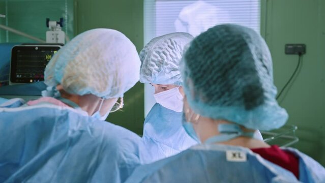 A Dedicated Team of Experienced Female Doctors Expertly Performs a Caesarean Section, Ensuring the Best Maternal and Infant Health. Witness Healthcare Expertise in Surgery, C-Section, and Childbirth.