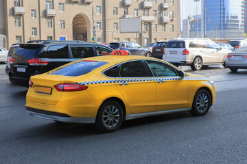 Taxi rides along the avenue in the city center