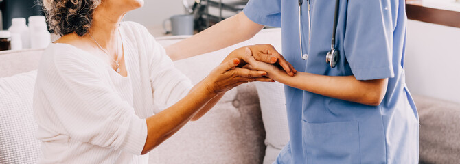 Happy young female nurse provide care medical service help support smiling old grandma at homecare...