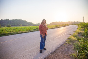 women asian standing on the countryside road