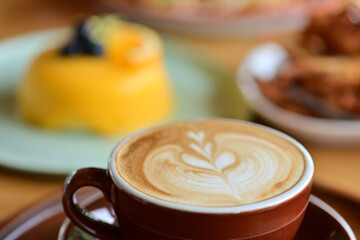 high angle view of coffee cup on wood grain table Drinking Concept: Hot Coffee, Latte, Espresso, Cappuccino