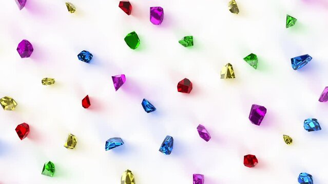 Colorful gemstones moving slowly on a white background. Seamless loop animation.