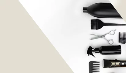  Composition with scissors, other hairdresser's accessories on white background. Professional items for a hairdressers, haircuts on a white background. © Alexa Mat