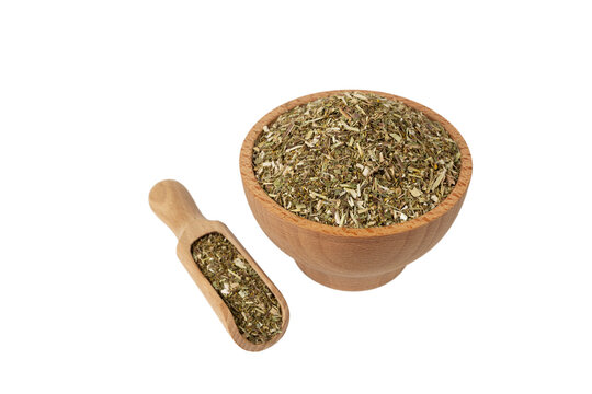Dry Tansy Herb in latin Tanacetum vulgare in latin sambuci flos in wooden bowl and scoop isolated on white background. Medicinal herb.