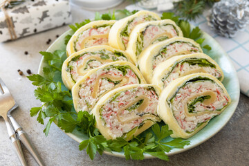 Creative appetizers christmas. Cheese roll with crab sticks, cream cheese and eggs.