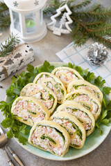 Creative appetizers christmas. Cheese roll with crab sticks, cream cheese and eggs.