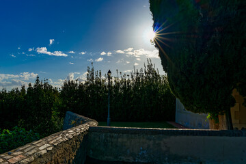 Backlit panorama on the perimeter walls in the village of Bolgheri Livorno Tuscany Italy