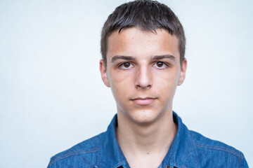 Portrait of Caucasian teenage boy on white background. High quality photo