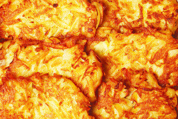 Portion of potato hash browns together. Country style. Close up. Indoor shot