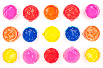 Pop-art concept. Wet paints on the white background. Avant-garde style. Close up. Studio shot