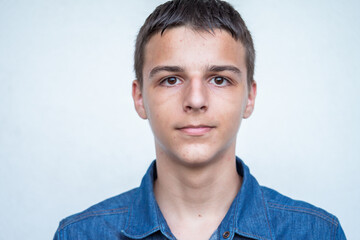 Portrait of Caucasian teenage boy on white background. High quality photo