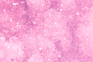 Amethyst pink crystals. Gems. Mineral crystals in the natural environment. Texture of precious and semiprecious stones. Seamless background with copy space colored shiny surface of precious stones.