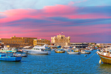 Fototapeta na wymiar Citadel of Qaitbay, famous fort in the Mediterranean harbour of Alexandria, beautiful sunset view, Egypt