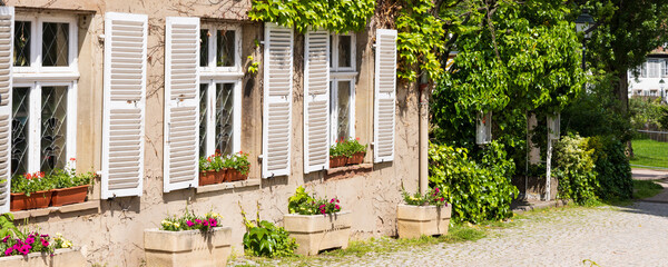 Cozy houses with flowers in the old town Petit France in Strasbourg in Elsace region along the Rhine river in France