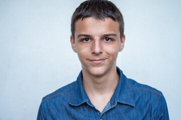 Portrait of Caucasian teenage boy on white background. High quality photo