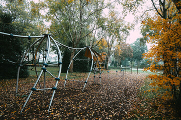Playground covered in yellow autumn leaves