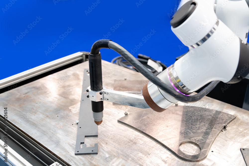Poster Automatic welding robot in a modern factory in operation