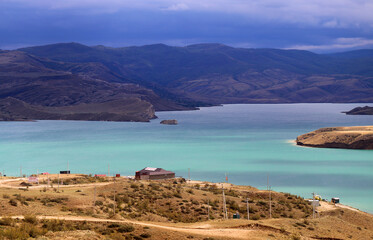 Photo of the blue reservoir among the mountains - 669621851