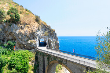 famous picturesque road viaduct of Amalfi summer coast with sea water, Italy, web banner format