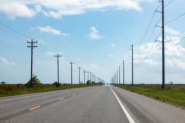 highway in texas with wooden eletrical pylons at the side, Texas, Willie