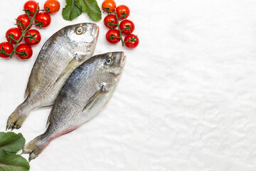 Fresh fish with red tomatoes and peppers