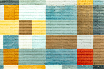colorful brick wall in different colors in geometric pattern © travelview
