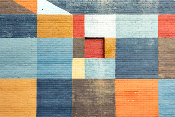 colorful brick wall in different colors in geometric pattern