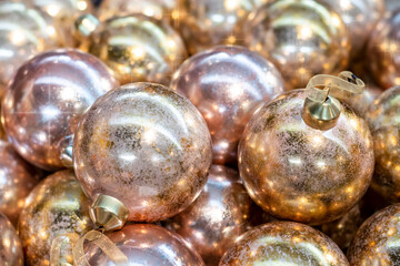 Christmas tree festive glittering background. Golden balls close up christmas background.  