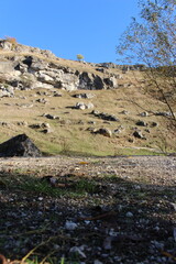A rocky hill with a dirt path