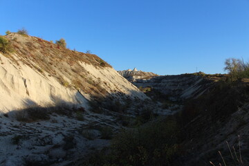 A rocky hill with a dirt road