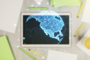 Digital America map and modern digital tablet on background, top view, international trading concept. Multiexposure