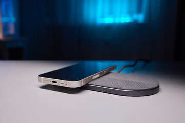 smartphone wireless charging on induction charger. Wireless charger